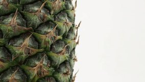 Ripe pineapple rotates on a white background. Pineapple close up - Powered by Shutterstock - Get 15% off with code: PIKWIZARD15