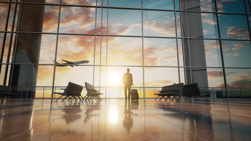 A Man Standing In Front Of A Window With A Plane Flying Overhead Airport Travel Photography Travel Insurance Royalty-Free Stock Footage #3400894231