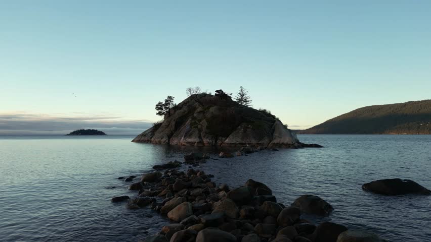 Rocky Shore on Pacific Ocean West Coast. Sunny Sunrise. Whytecliff Park, West Vancouver, BC, Canada. Nature Background.