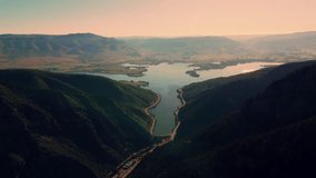 Aerial Footage overlooking Utah Pineview Reservoir and Vast Mountains