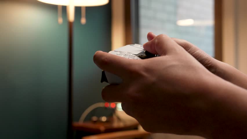 Hands of a young adult playing video games - Powered by Shutterstock - Get 15% off with code: PIKWIZARD15