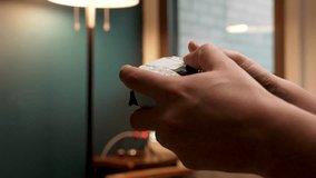 Hands of a young adult playing video games - Powered by Shutterstock - Get 15% off with code: PIKWIZARD15