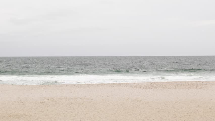 waves washing on the beach in Winter