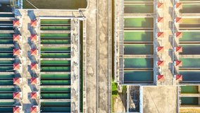 A mesmerizing sight of a wastewater treatment plant from above, showcasing its intricate network of tanks and pipes, a testament to modern environmental stewardship. Pure drinking water concept.
