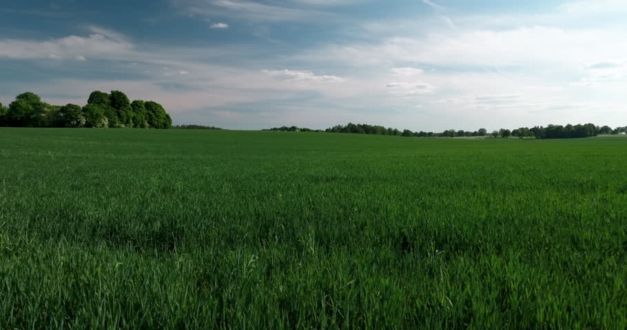 Aerial: Drone Panning Scenic Shot Of Grassy Green Landscape Under Cloudy Sky On Sunny Day - Mariefred, Sweden