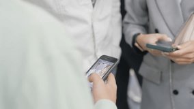 Woman scans QR code on friend phone screen in office closeup. Businesswoman exchanges digital information with colleague at meeting - Powered by Shutterstock - Get 15% off with code: PIKWIZARD15