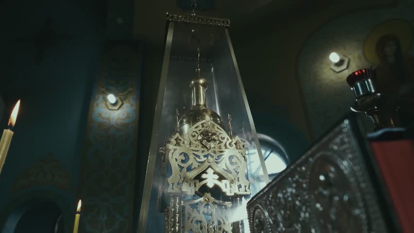 Little golden church under glass