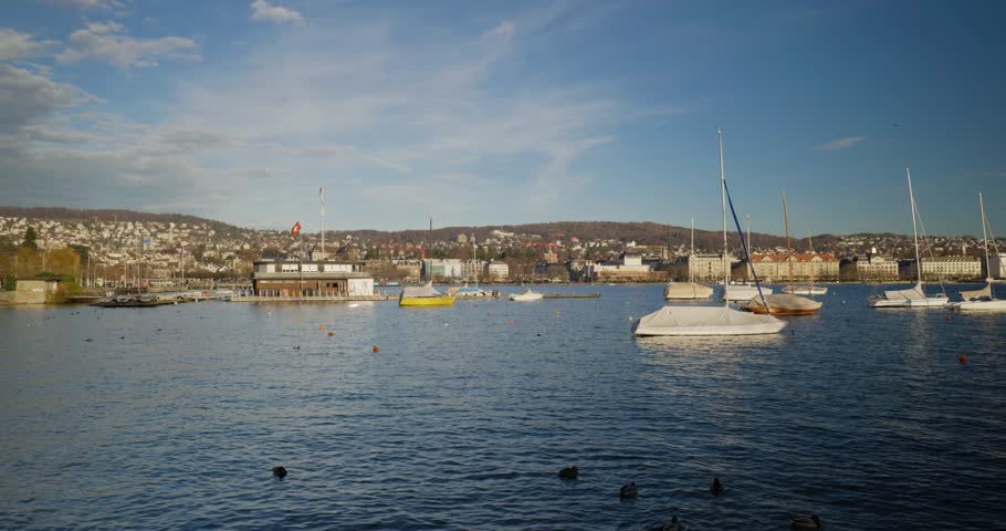 Small sail boats on lake Zurich, Switzerland. Sunny winter day, real time, no people
