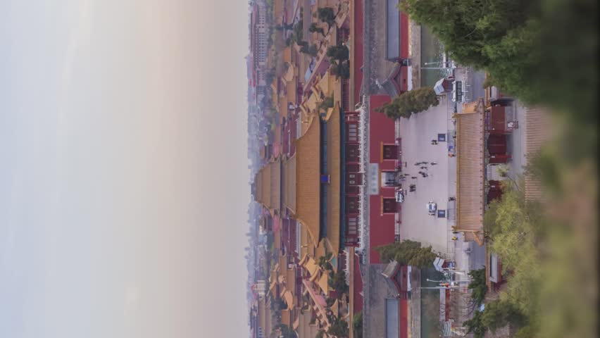 Forbidden City and Beijing Skyline, China. View from Jingshan Park at Sunset. Day to Night Time Lapse. Vertical Video