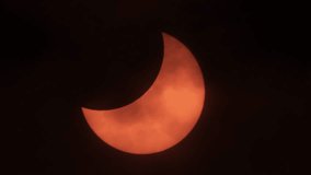 Movement of Clouds in Front of Sun During a Solar Eclipse. Moon Cast Shadows Covering During Partial Solar Eclipse With Clouds Moving. Partial Solar Eclipse When Sun Rise in Europe October 25, 2022.	
 - Powered by Shutterstock - Get 15% off with code: PIKWIZARD15