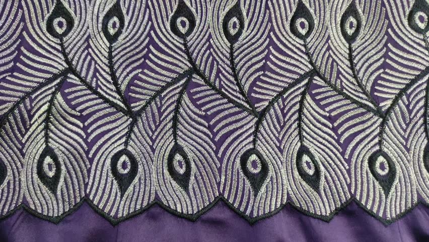 An embroidery work on a purple sateen fabric