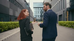 Back view from behind businesspeople collaboration colleagues communicate cooperation business coworkers discuss deal employees entrepreneurs executives talking walking in city near office negotiate - Powered by Shutterstock - Get 15% off with code: PIKWIZARD15