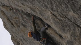 Rock Climbing. Man Climbs the Cliff. Slow Motion. Vertical Video