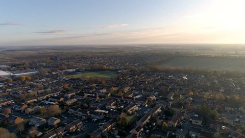 Flyby Over British Town at Dawn, Aerial View