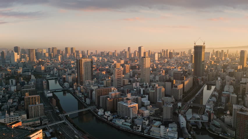 aerial view of osaka city skyline at sunrise dawn minami nishi ward with business financial umeda district in the background