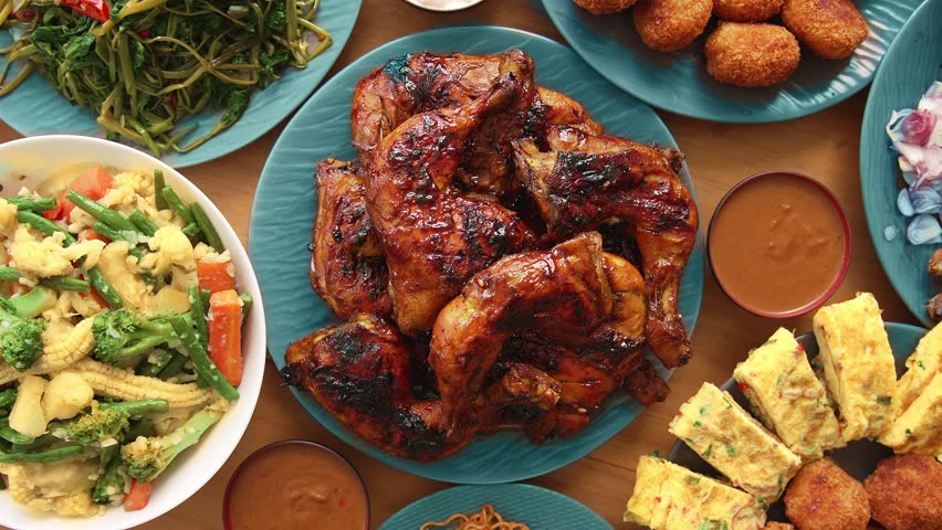 Eating Fresh Meal of Traditional Asian Food on Family Table. Cooking Healthy Delicious Cuisine in Asia Style. Appetizer of Seasoned Chicken Meat Served with Vitamin Vegetables and Yummy Japan Omelette