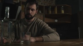 Staying sober. Close up of young bearded man crossing his arms and showing his refusal from alcohol