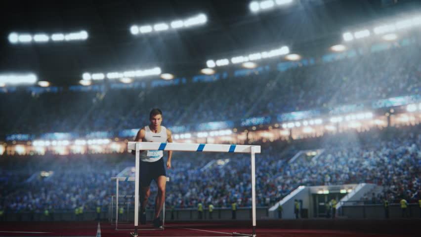 Sports Footage with Super Slow Motion Speed Ramp Effect. Talented Male Hurdler Jumping Over Obstacle, Racing Against Time and Setting a New Sprint Record in Front of a Stadium with Cheering Fans Royalty-Free Stock Footage #3401763929
