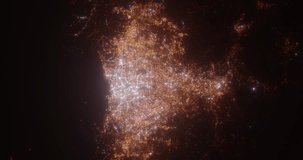 Jakarta (Indonesia) top view at night. View on modern city from satellite. Camera is zooming in, rotating counterclockwise. Vertical video. The north is on the left side