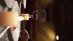 Young couple in love having dinner in restaurant drinking red wine clinking glasses while sitting at table with candles and dishes celebrating Valentine's day or anniversary at home - Powered by Shutterstock - Get 15% off with code: PIKWIZARD15