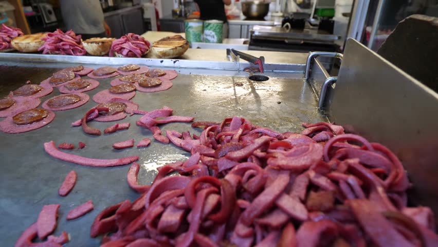 Traditional delicious Turkish street food; Izmir cesme kumru sandwich made of cheese, soudjouk, salami, soudjouk, tomato and pepper