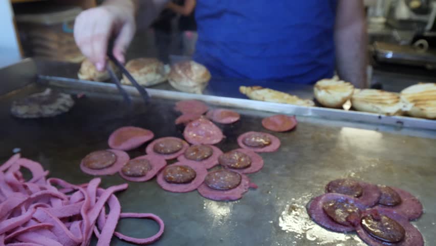 Traditional delicious Turkish street food; Izmir cesme kumru sandwich made of cheese, soudjouk, salami, soudjouk, tomato and pepper