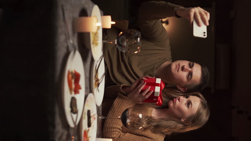Couple in love taking selfie while having dinner in restaurant or at home celebrating valentine's day or anniversary Royalty-Free Stock Footage #3401930779