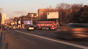 Time lapse Traffic Cars with pedestrian at sunset. Defocused video