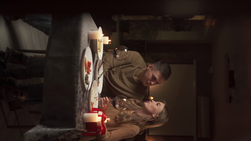 Couple flirting having dinner in the evening with candles at home Royalty-Free Stock Footage #3401939879
