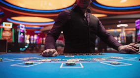 Online Casino: Professional Croupier Deals Cards on Blackjack Table. Anonymous Dealer Masterfully Revealing Jackpot Possibly Winning Hand, Excitement in High-Stakes Game for Payout. Close-Up Tilt Shot - Powered by Shutterstock - Get 15% off with code: PIKWIZARD15