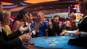 Group of Casino Goers Enjoying Time in a Modern Casino, Friends Placing Blackjack Bets, Professional Female Croupier Deals Cards. Diverse Group People Playing, Placing Bets Winning and Celebrating - Powered by Shutterstock - Get 15% off with code: PIKWIZARD15