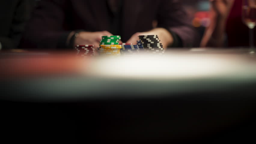 Anonymous Man Dressed in Suit Collecting his Prize of Poker Chips in a Modern Casino. Lucky Male Winner Hitting the Jackpot, Happy About His Risky Bet that Paid of Handsomely. Slow Motion Grab Royalty-Free Stock Footage #3401949525