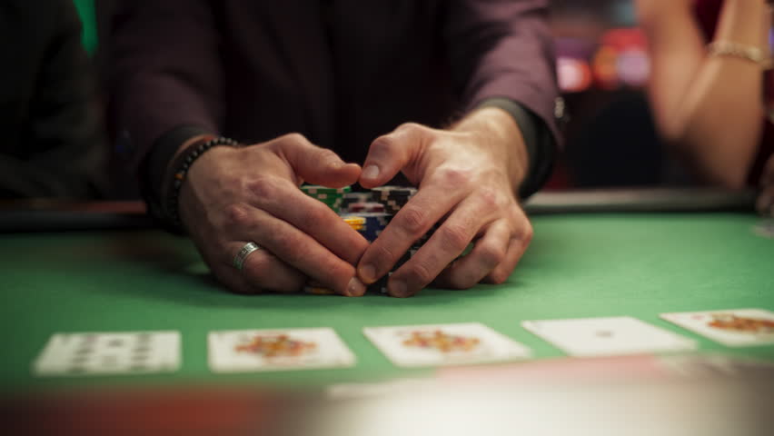 Anonymous Man Dressed in Suit Collecting his Prize of Poker Chips in a Modern Casino. Lucky Male Winner Hitting the Jackpot, Happy About His Risky Bet that Paid of Handsomely. Slow Motion Grab Royalty-Free Stock Footage #3401949525