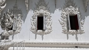 Artistic sill lintel and railings of (Thai: 'Wat Rong Khun') at Chiang Rai, Mueang Chiang Rai, Thailand - October 4 2023