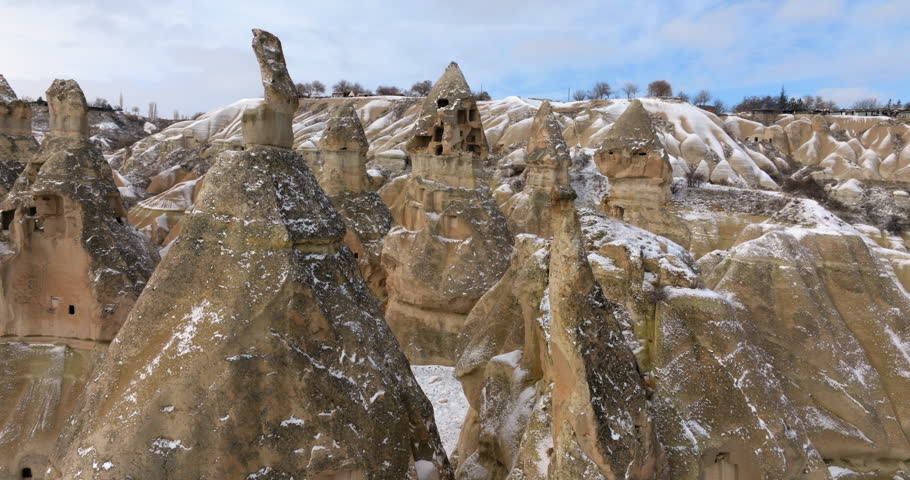 Aerial Forward Scenic Shot Of Goreme National Park In Snowy Weather Under Cloudy Sky - Cappadocia, Turkey