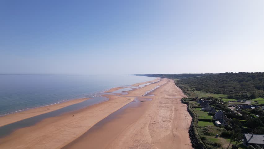 Omaha Beach is a landing area in Normandy, northern France, used by Allied forces in the WWII D-Day invasion. At the top of the bluff overlooking Omaha is the Normandy American Cemetery and Memorial.
