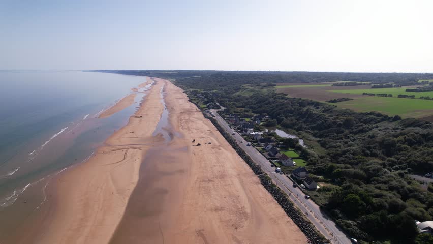 Omaha Beach is a landing area in Normandy, northern France, used by Allied forces in the WWII D-Day invasion. At the top of the bluff overlooking Omaha is the Normandy American Cemetery and Memorial.