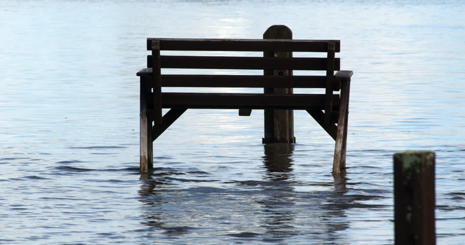 benches unacceptable at high tide due to flooding at Ashlett creek in the Solent, Southampton Royalty-Free Stock Footage #3402116857