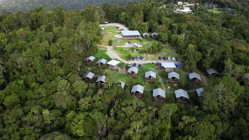 O’Reilly’s campground set out amongst the pristine rainforest of UNESCO World Heritage Lamington National Park. Drone view