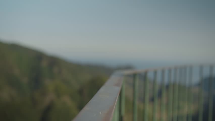Female hands grabbing steel railing at mountain viewpoint, close up Royalty-Free Stock Footage #3402135765