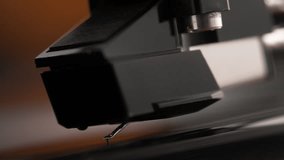 Turntable Stylus Attached to the Phono Cartridge Lowering onto the Spinning Vinyl Record in Macro and Slow Motion - Listening Room - Powered by Shutterstock - Get 15% off with code: PIKWIZARD15