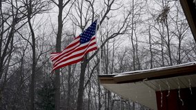 A late Winter flurry blowing through an American Flag. - Powered by Shutterstock - Get 15% off with code: PIKWIZARD15