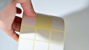 Opening barcode roll labels by hand. Opened thermal barcode roll.	 - Powered by Shutterstock - Get 15% off with code: PIKWIZARD15