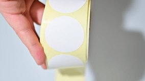 Opening barcode roll labels by hand. Opened thermal barcode roll.	 - Powered by Shutterstock - Get 15% off with code: PIKWIZARD15