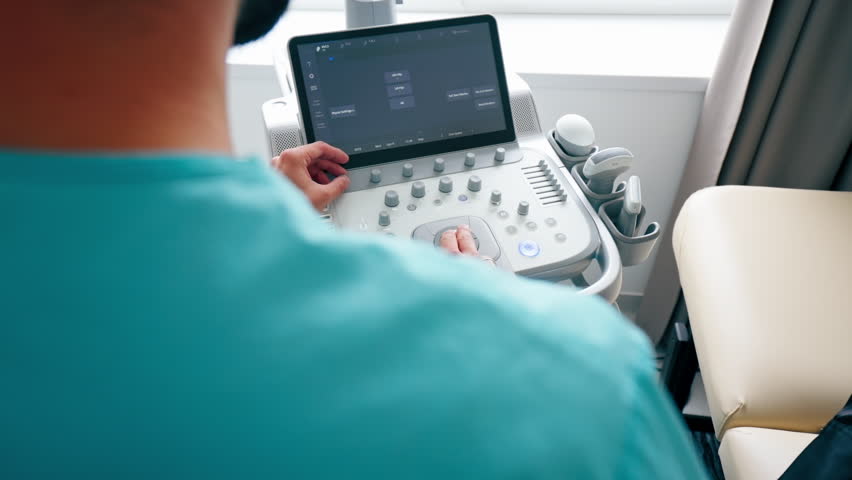 Close-up shot of an ultrasound diagnostic machine in a medical center for scanning the state of the body Royalty-Free Stock Footage #3402435289