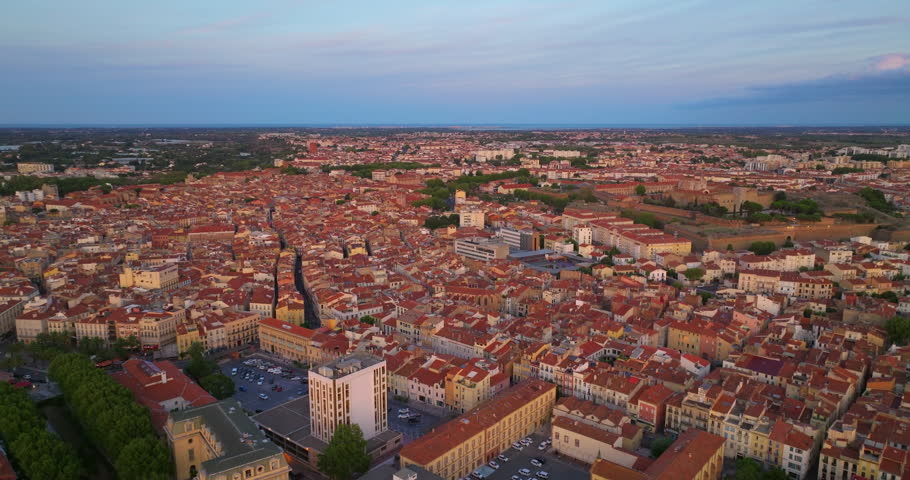 Aerial view of Perpignan, France. Residential buildings and Tet River visible from above. City centre