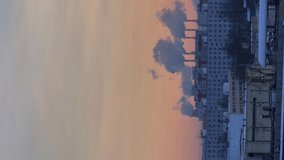 Day to Night Timelapse of Buildings in Sleeping District and Passing Trains at Sunny Winter Sunset. Vertical Video - Powered by Shutterstock - Get 15% off with code: PIKWIZARD15