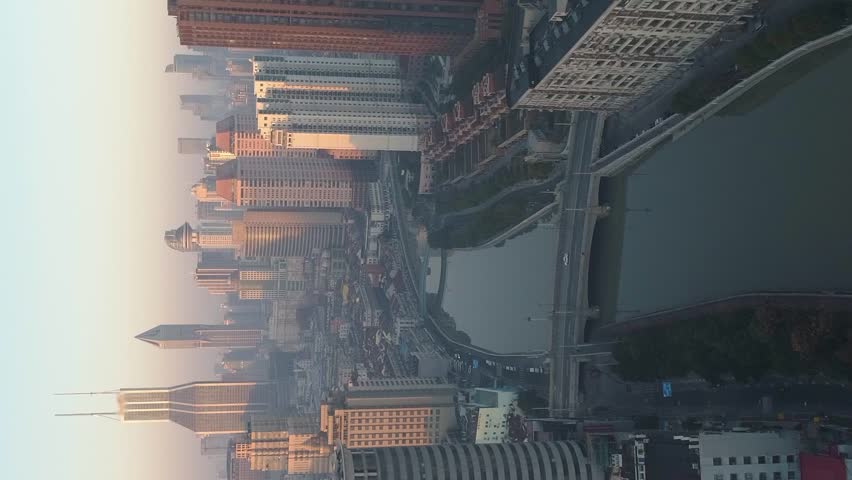 Shanghai Skyline in the Sunny Morning. Puxi District. China. Aerial View. Drone is Flying Forward and Upward. Establishing Shot. Vertical Video