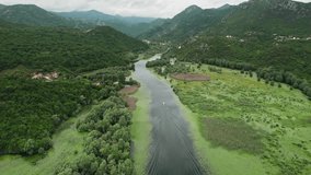 Aerial footage captures the stunning view of the horseshoe-shaped river bend at Pavlova Strana near Skadar Lake in Montenegro. The footage provides a mesmerizing view of the natural beauty in 4K. 