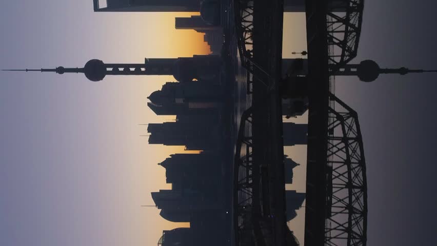 Panoramic Shanghai Skyline at Dawn. Lujiazui Financial District and Huangpu River. China. Aerial View. Drone is Flying Sideways and Upward. Establishing Shot. Vertical Video Royalty-Free Stock Footage #3402500419